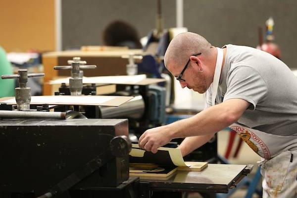 Male student working in art studio