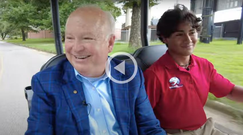 President Bonner with Julian in the Golf Cart.